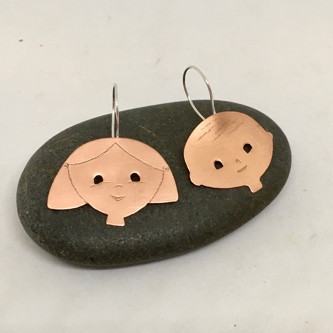 handcrafted handcut copper earrings, designed and created as wearable art. Handmade sterling silver ear hooks. Boy/Girl theme design